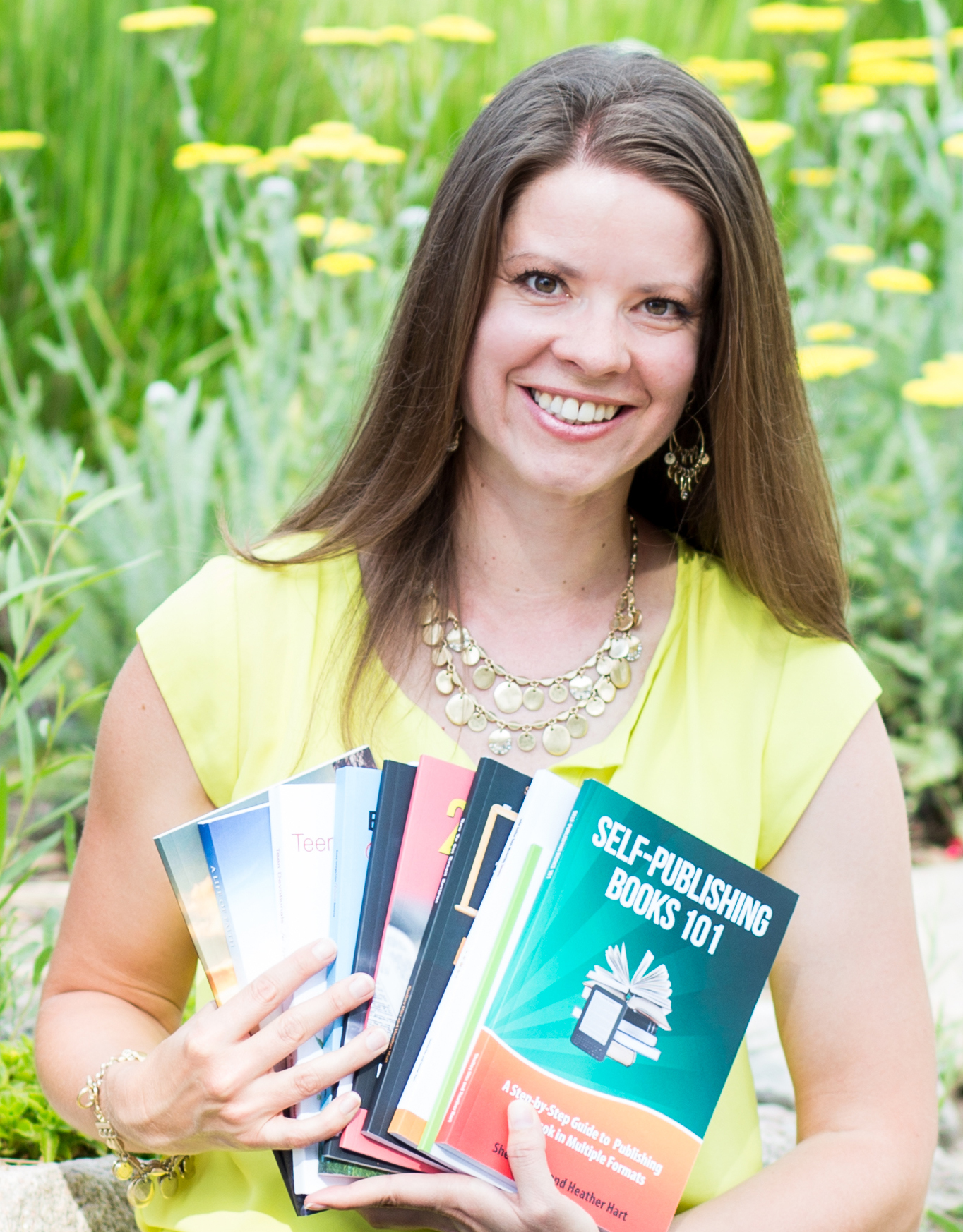 Shelley Hitz holding her published books