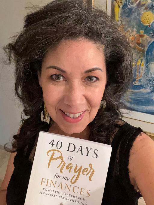 Patti Fagan holding 40 Days of Prayer for My Finances