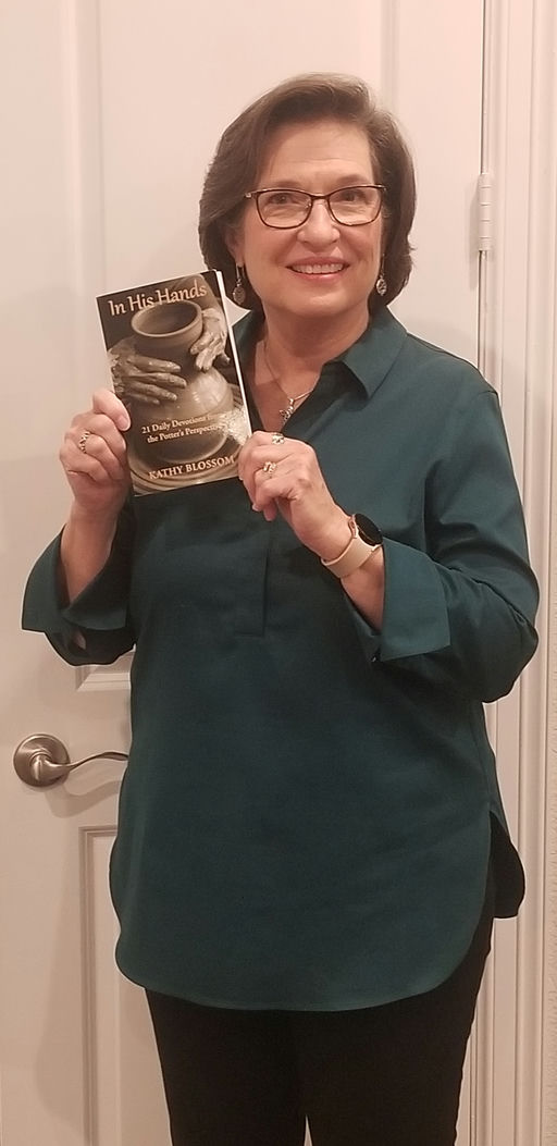 Kathy Blossom holding In His Hands